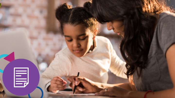 Teacher helping a student with writing