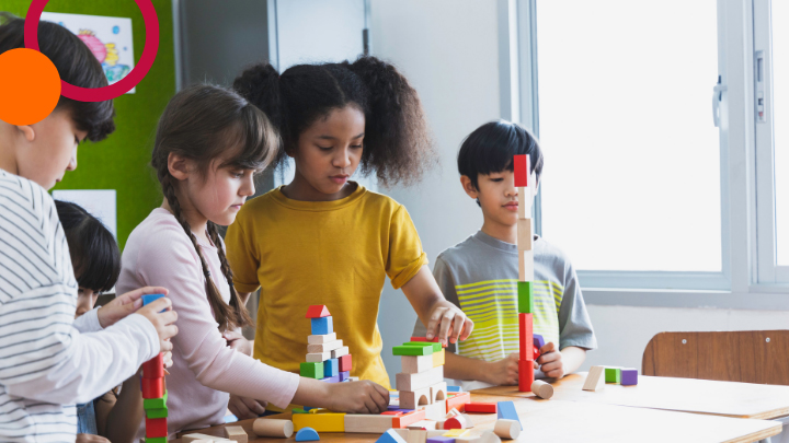 Kids building with blocks together.