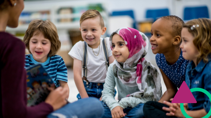 Teacher reading to young students.