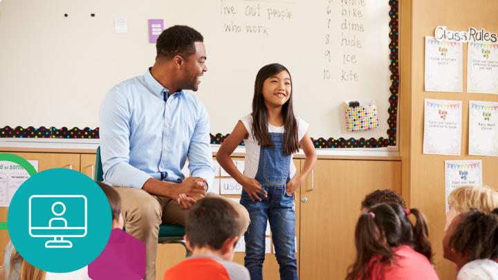 Teacher and student in front of classroom