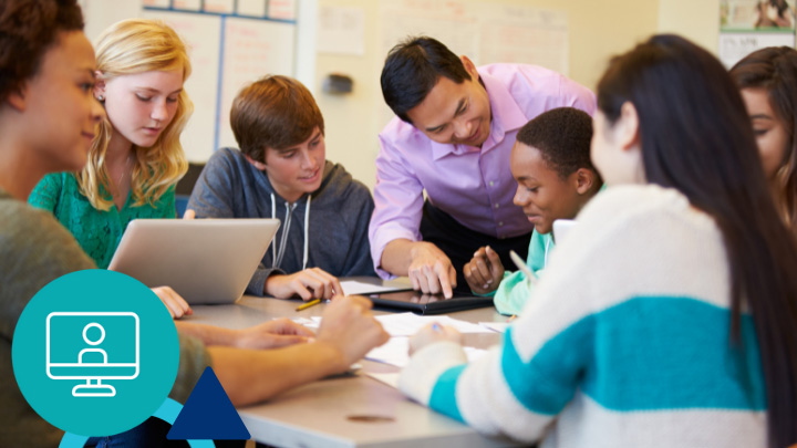 Teacher helping students