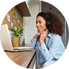 Woman smiling at laptop