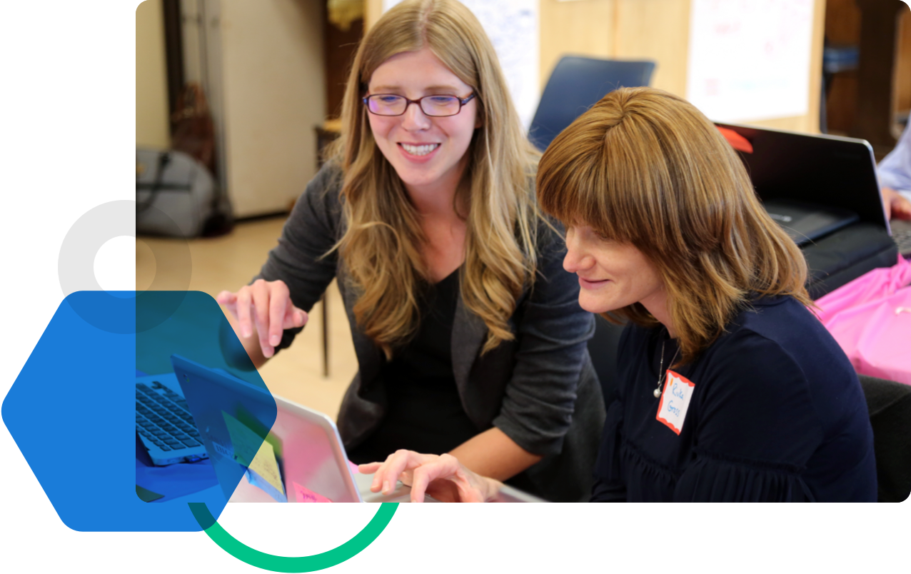 Two teachers using laptop