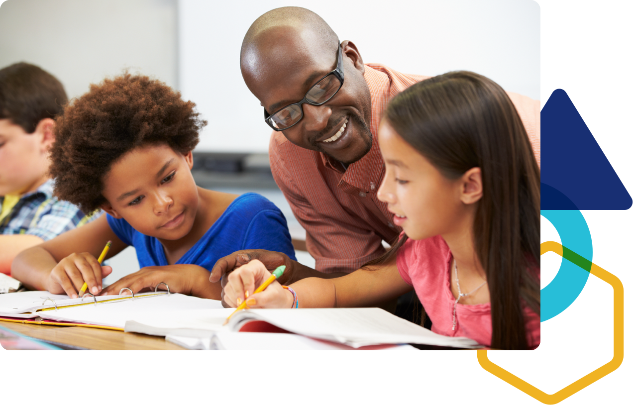 Teacher helping two students