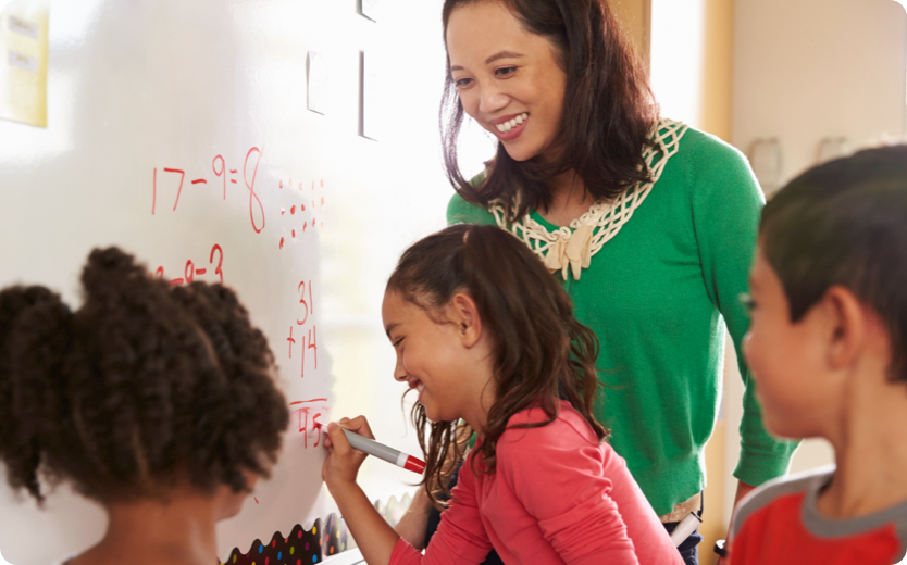 Teachers and students using whiteboard