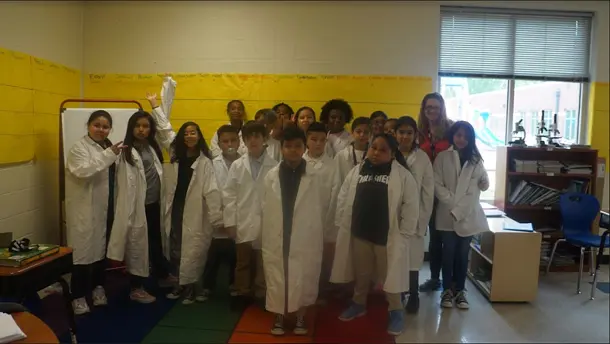 Students wearing labcoats